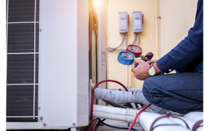 Technician performing aircon gas top-up service
