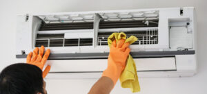 Technicians performing aircon servicing and maintenance