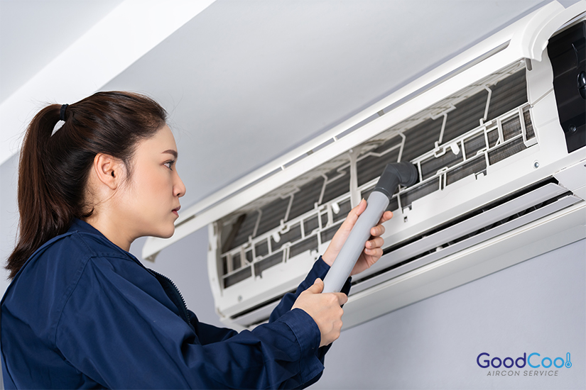 Woman cleaning air conditioner