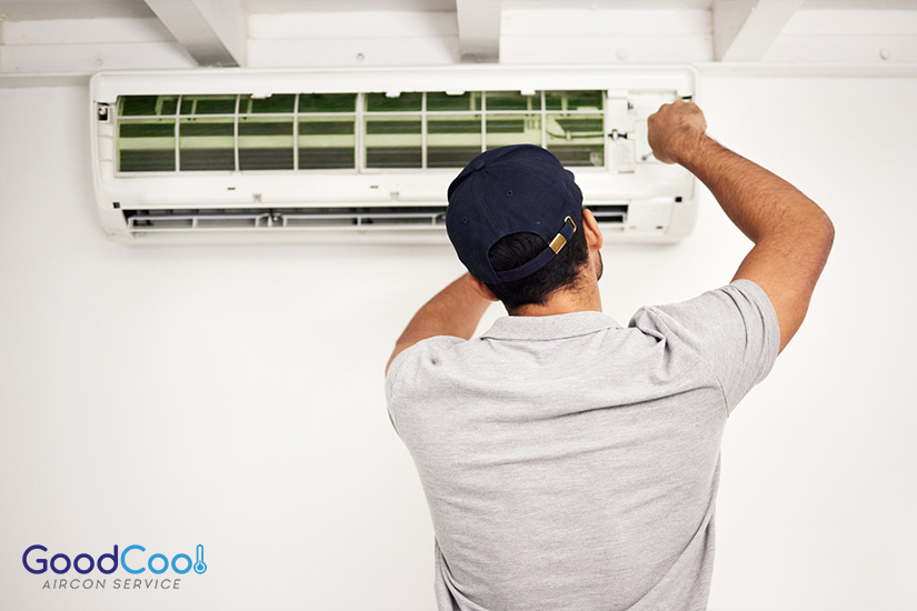 Aircon professional doing maintenance