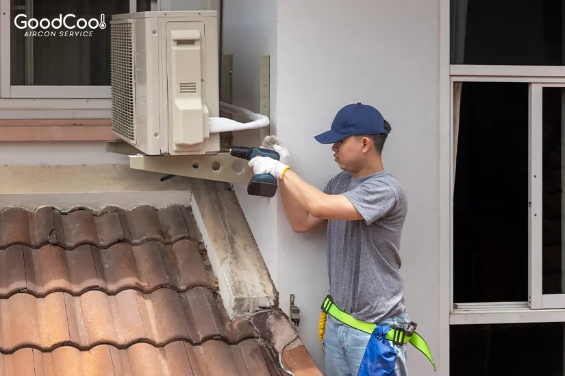 A technician repairing an aircon condenser