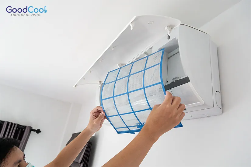 HVAC technician replacing air conditioner air filters
